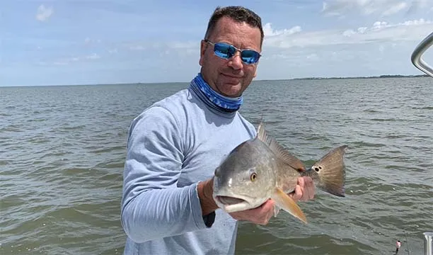 Man holding a fish
