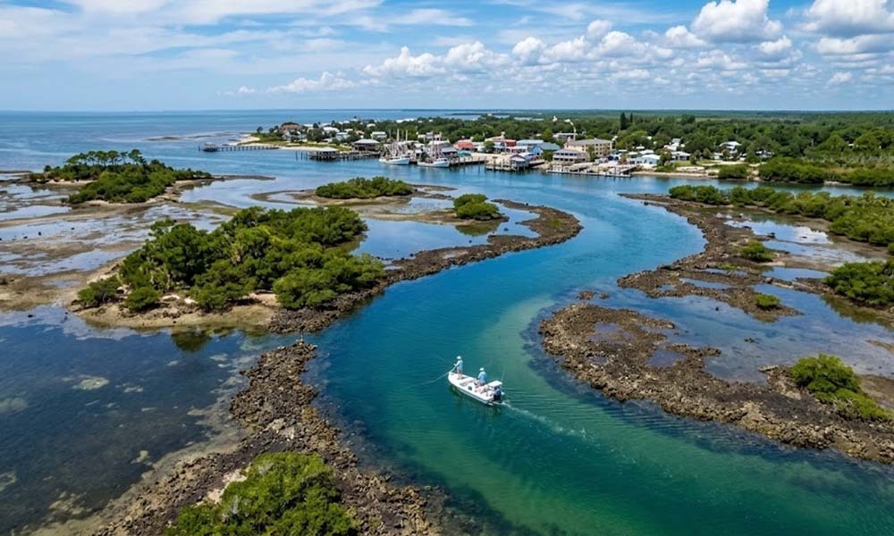 Boat navigating coastal waterway.